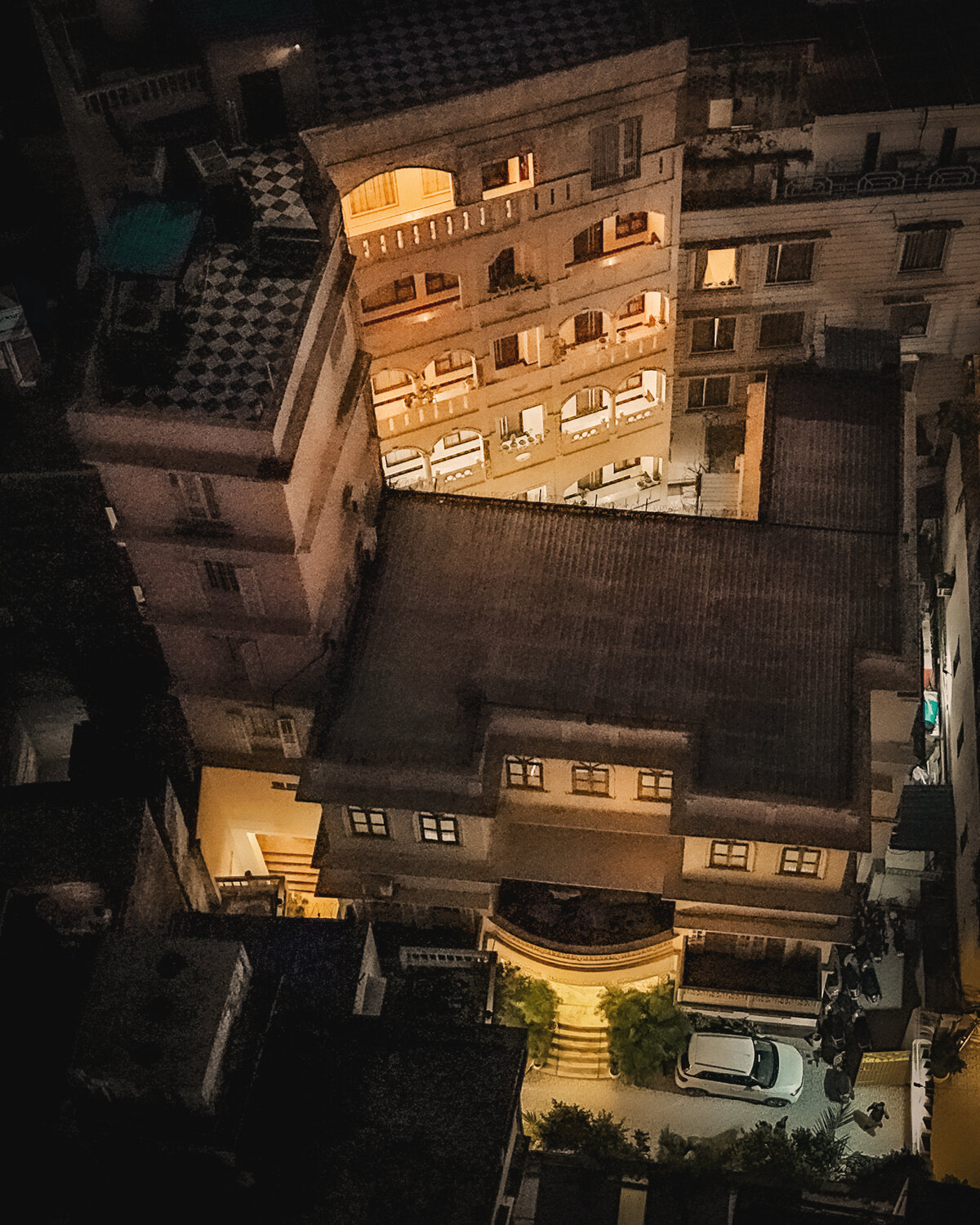 The hotel's lit balconies and galleries at night